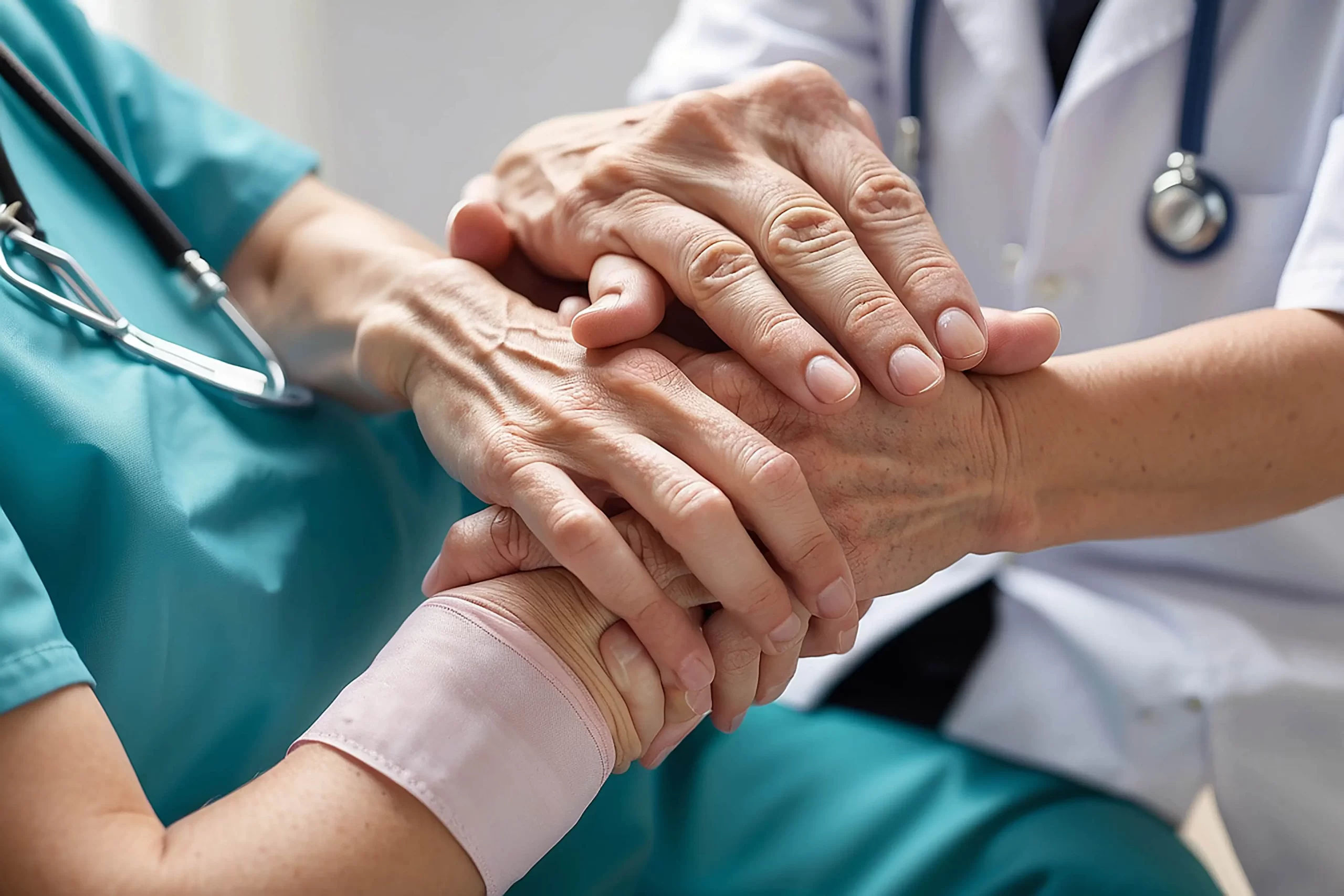 female-nurse-hold-her-senior-patients-hand